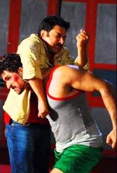 John in an action scene with Mamooty, in the movie Love in Singapore