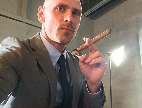 Johnny Sins smoking a cigar