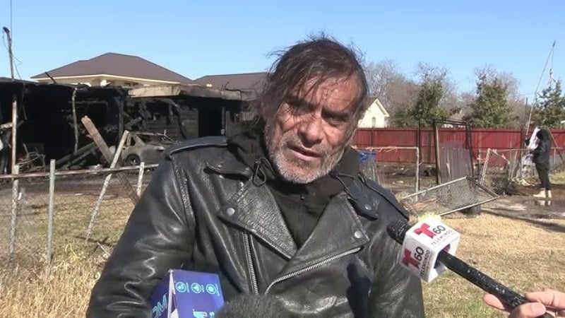 Jonathan Joss during an interview in front of his burned-down home