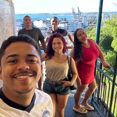 Joseane Ribeiro (in red dress) during a trip