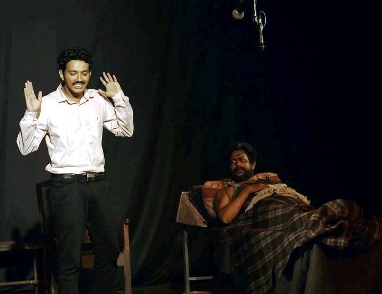 Joseph Mathews (left) in a still from a theatre play