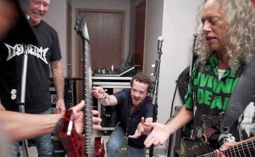 Joseph Quinn playing guitar with the Metallica band