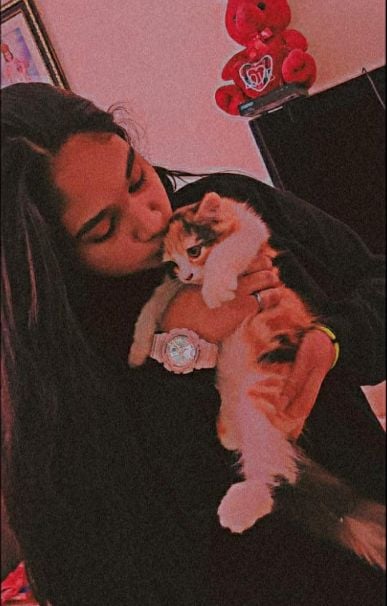 Jovika Vijaykumar with a cat
