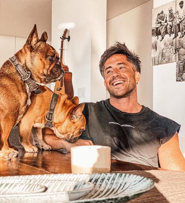 Juan Pablo de Vigili posing with his pet dogs