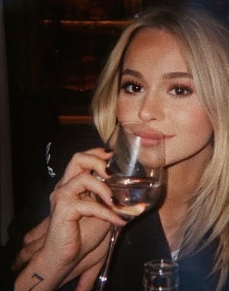 Julia Bonilla while enjoying an alcoholic beverage