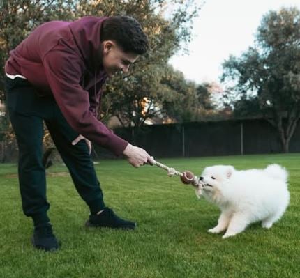 Julian Alvarez with his pet dog, Tarzan