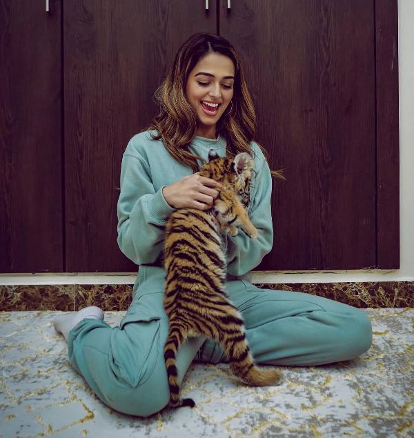 Jumana Khan playing with a cub