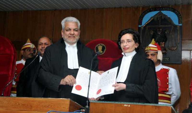 Justice Dharam Chand Chaudhary, Acting Chief Justice of the High Court, administering the oath of office to Jyotsna Rewal Dua as the Additional Judge of the High Court in 2019