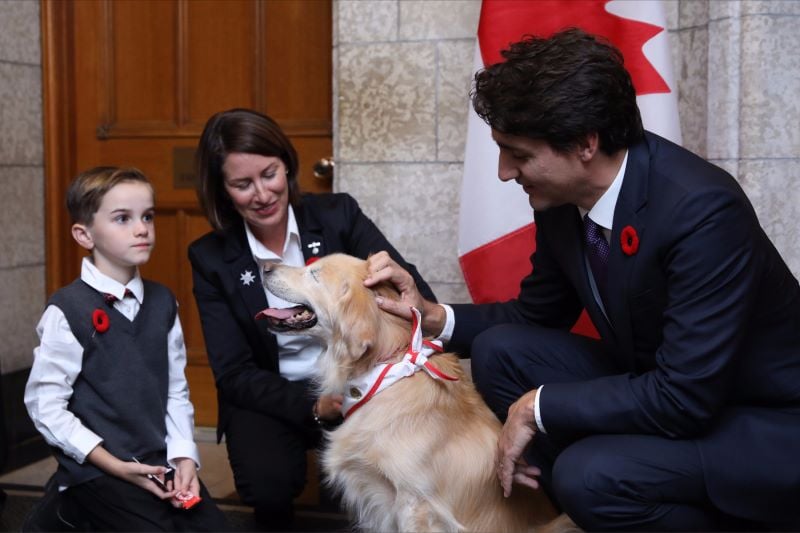 Justin Trudeau with a dog in the Office of the Prime Minister