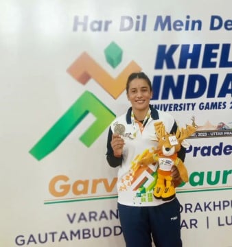 Jyoti Thakur posing with a medal during the Khelo India University Games