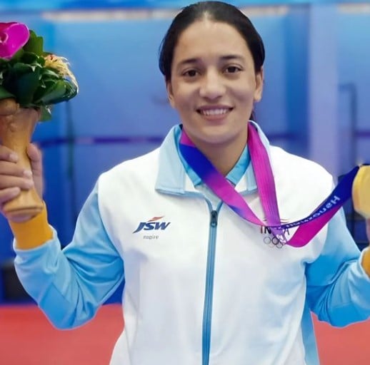 Jyoti Thakur while posing with the gold medal after winning in the Asian Games organised in Hangzhou, China