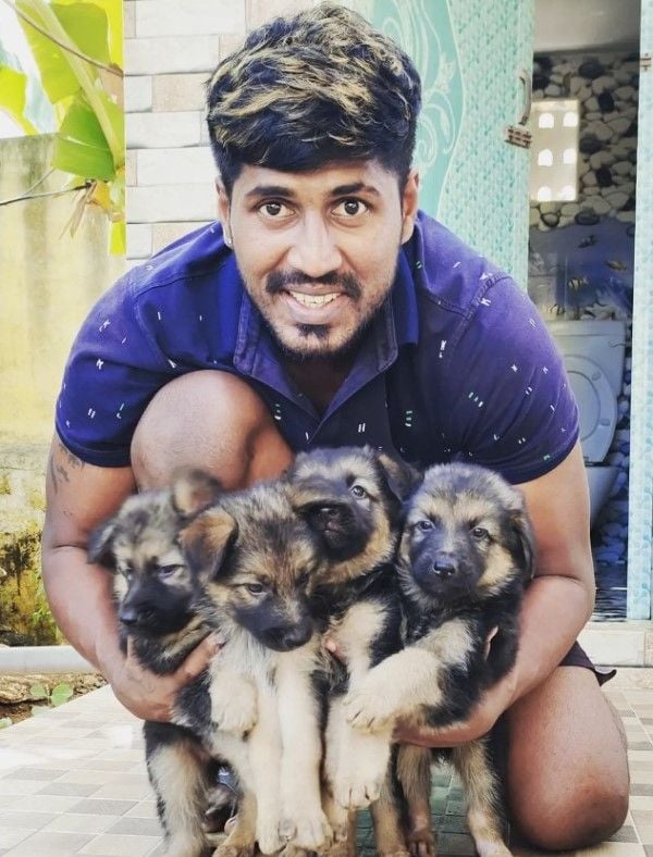K Prapanjan with puppies