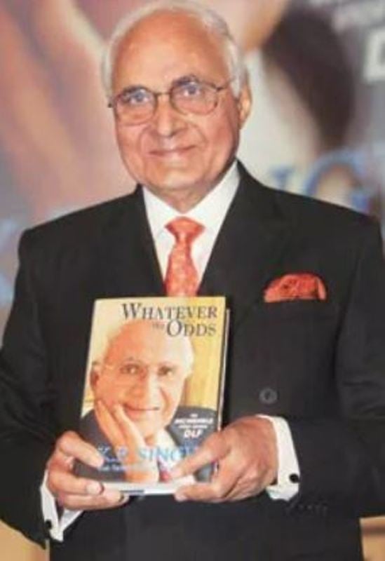 K. P. Singh while holding his book 