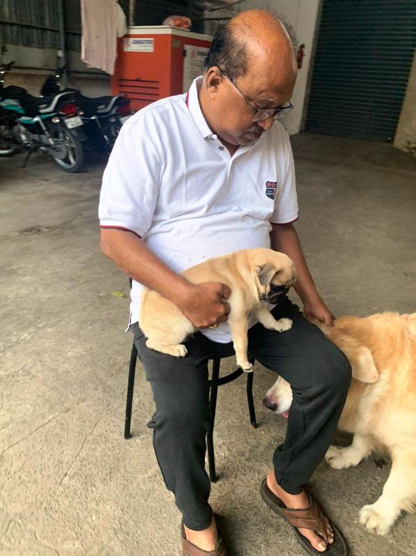 K. V. Thomas with his pug, Archie