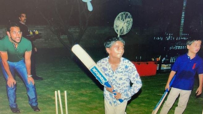 Kabir Bahia (centre) playing cricket with Mahendra Singh Dhoni