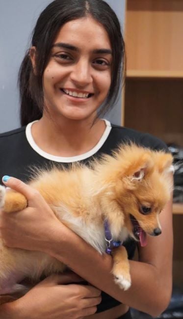 Kajal Jangra holding a Pomeranian
