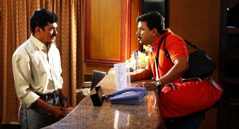 Kalabhavan Haneef (left) as a hotel receptionist in the film Vinodayathra (2007)