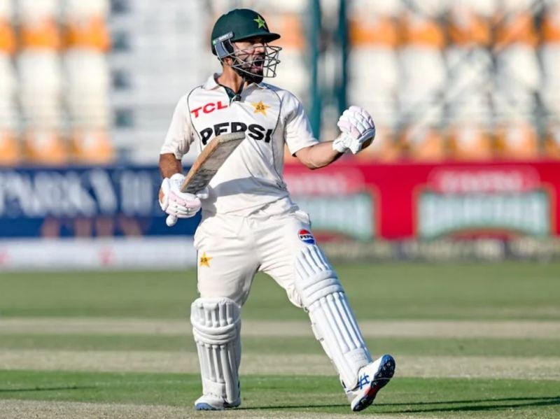 Kamran Ghulam celebrating after scoring a century on his test debut