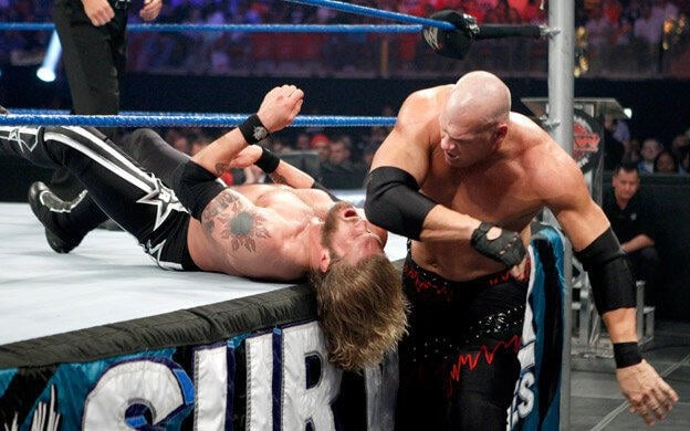Kane attacking Edge during their WWE Heavyweight Championship match