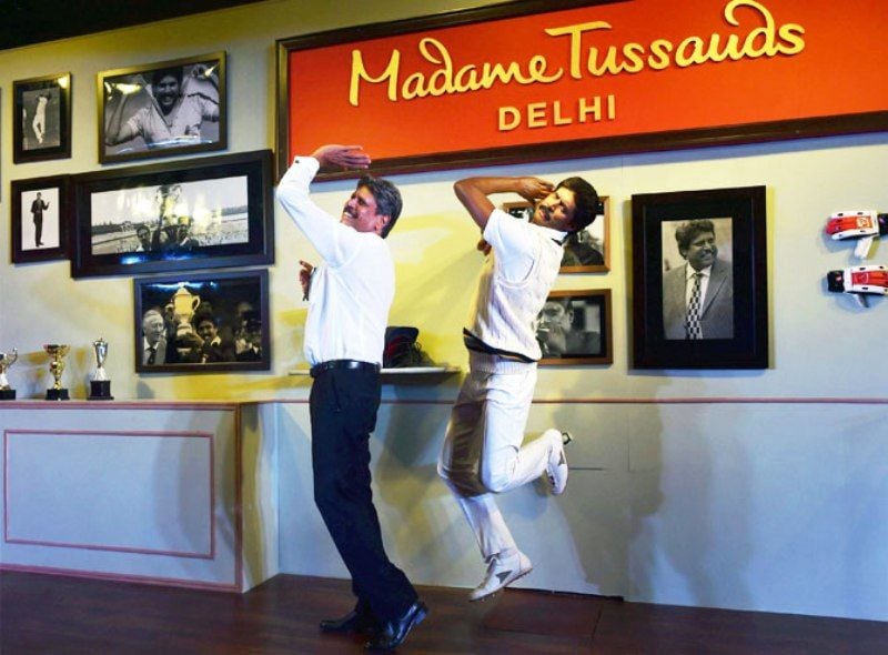 Kapil Dev Posing With His Wax Statue At New Delhi