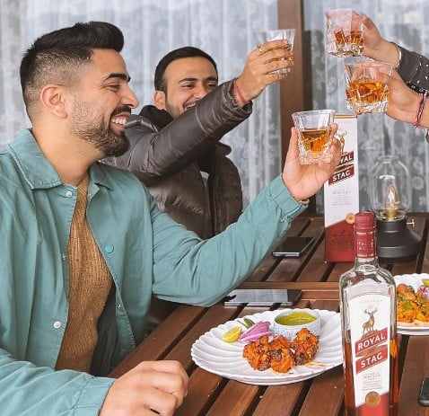Karan Sehgal while enjoying an alcoholic beverage with his friends