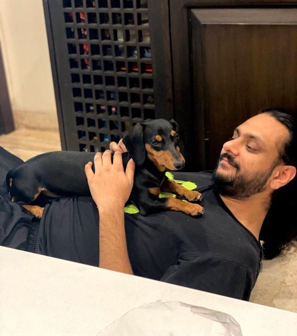 Karan Singh posing with his pet dog Phoebe Singh Magic