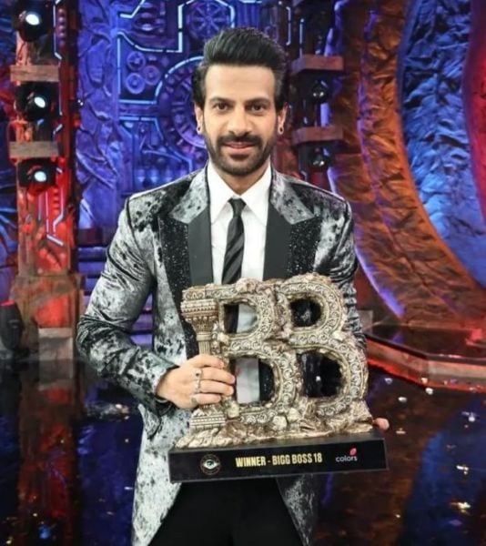 Karan Veer Mehra holding the Bigg Boss 18 trophy which he won
