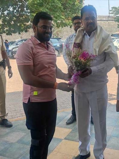 Kashinath Chaudhari (in red) with local politicians
