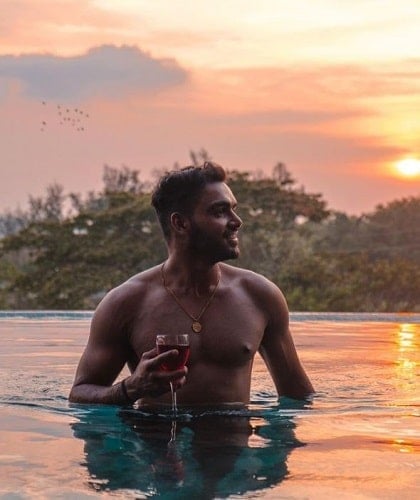 Kashish Thakur Pundir holding a glass of red wine