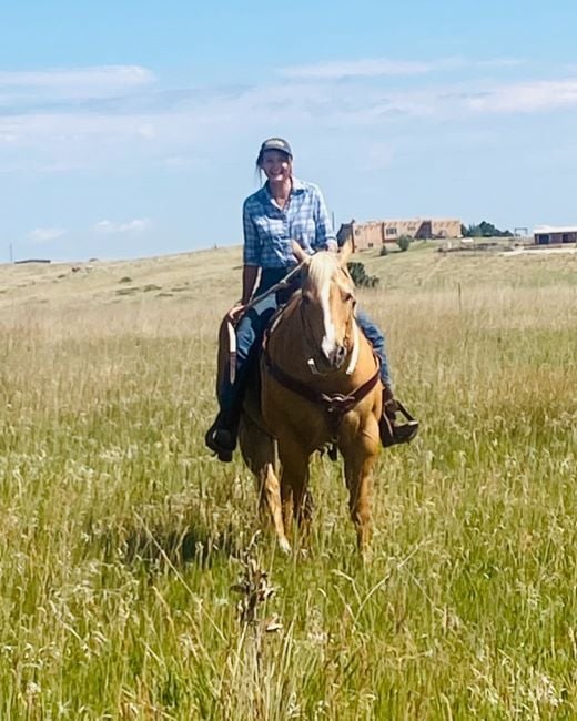 Kathy Sabine riding a horse