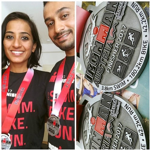 Kaushik Mukherjee and his wife wearing Ironman Medal