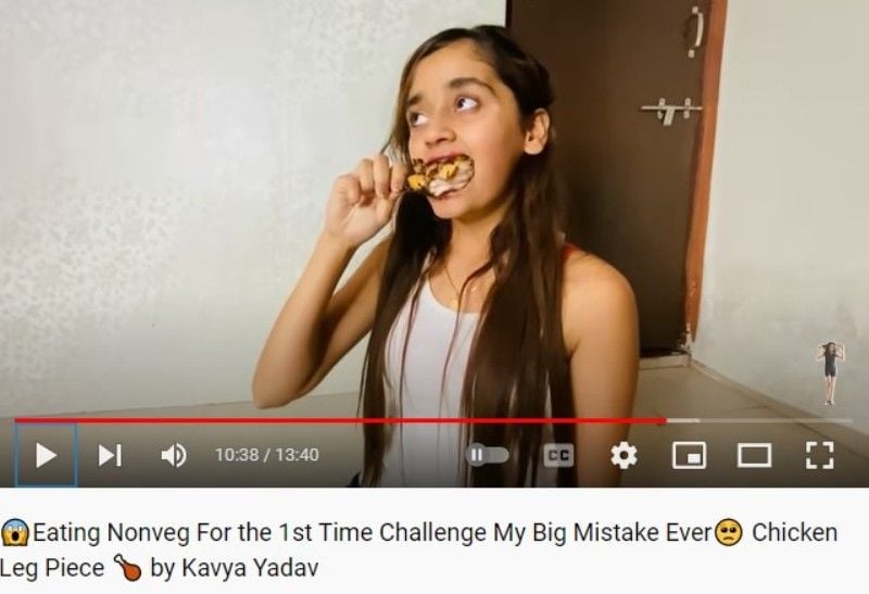 Kavya Yadav eating chicken in her YouTube vlog titled 