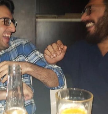 Kayoze Irani with his friend and alcohol bottle