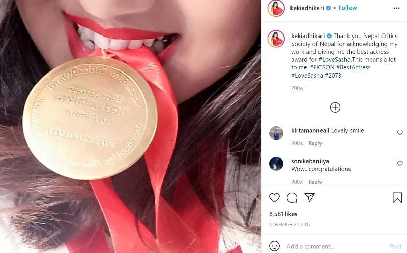 Keki Adhikari with a medal that she won for the best actress in Love Sasha