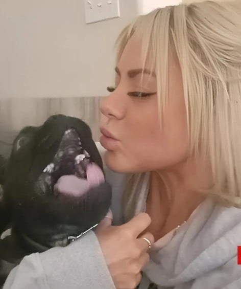 Kelsey Bateman posing with her pet dog