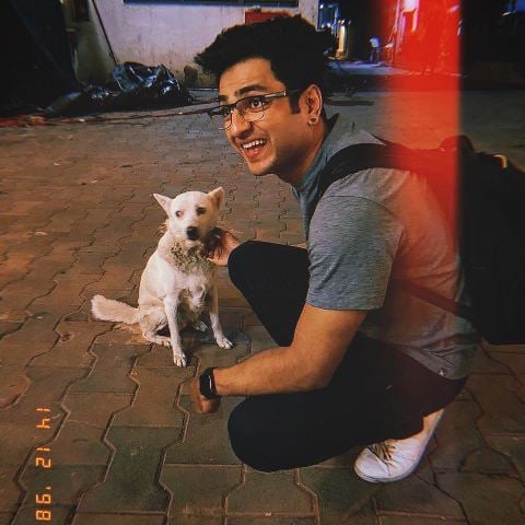 Kenny Sebastian with a dog