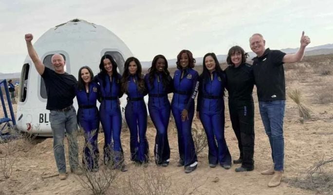 Kerianne Flynn (second from left) with other crew members after landing