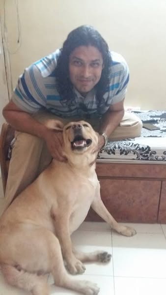 Ketan Karande playing with his dog