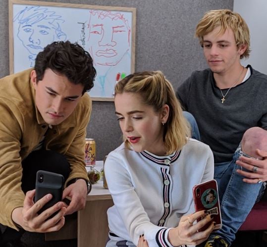 Kiernan Shipka (middle) during the shoot of the Netflix series Chilling Adventures of Sabrina