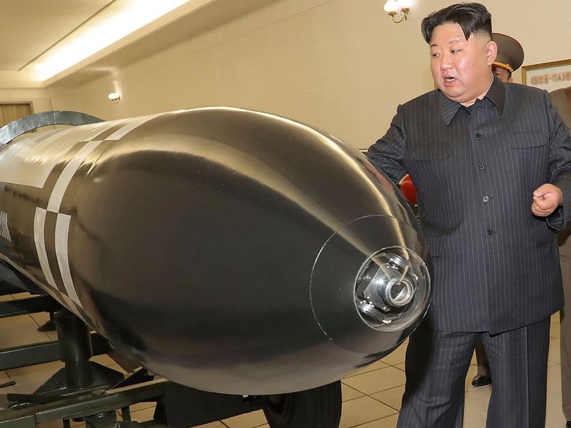 Kim Jong-un inspecting a nuclear warhead of a missile before its launch