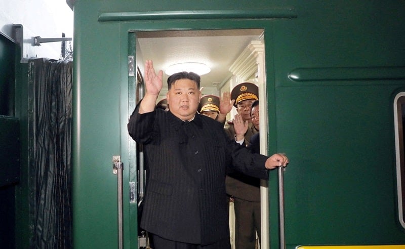 Kim Jong-un waving from his bulletproof train before departing