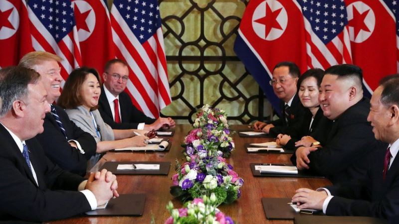 Kim Jong-un with his team meeting with President Donald Trump and his team