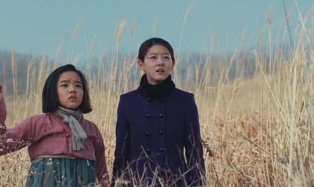 Kim Sae-ron (right) in a still from the film Snowy Road