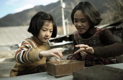 Kim Sae-ron (left) in a still from the film A Brand New Life
