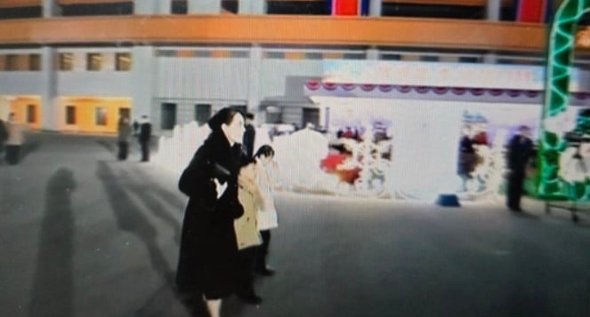 Kim Yo-jong was seen walking with children toward outdoor tables at Pyongyang