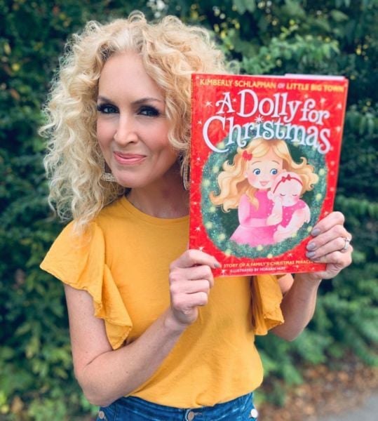 Kimberly Schlapman with her book titled 