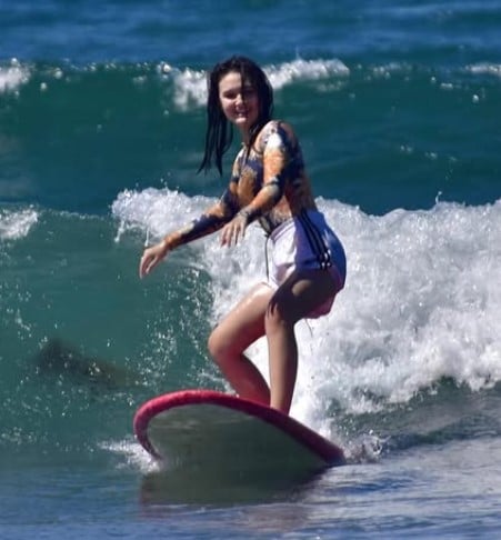 Kira Balinger while enjoying water surfing