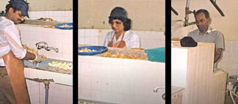 Kiran Mazumdar with her two employees at her garage