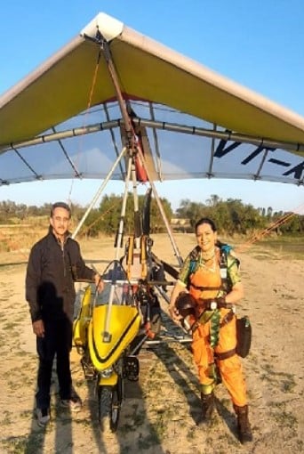 Kirti Vardhan Singh and Shital Mahajan posing after a skydiving flag jump