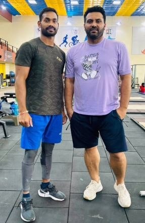 Kishore Jena with his coach, Samarjeet Singh Malhi (right)